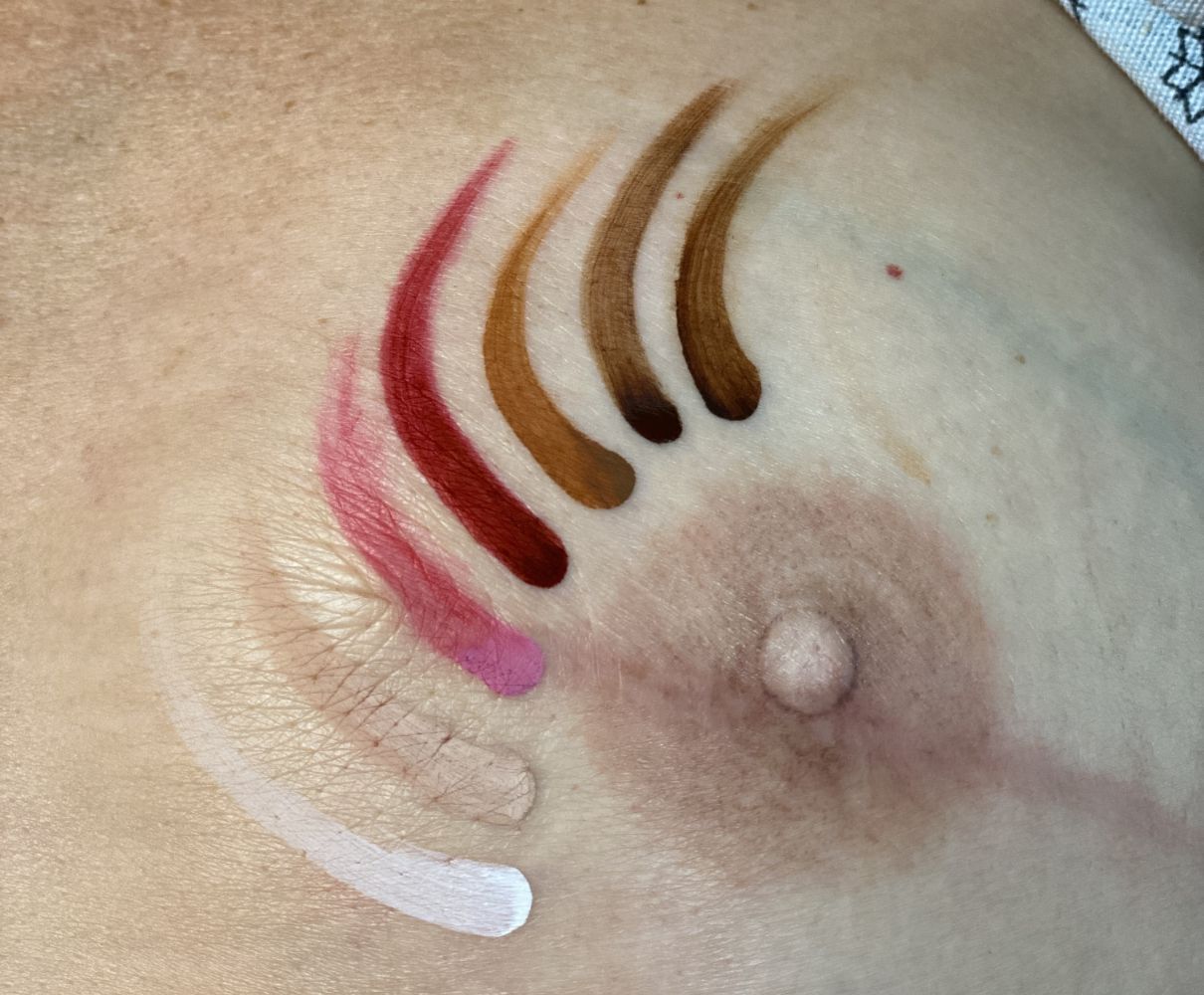 Close-up of PMU artist practicing restorative areola tattoo technique